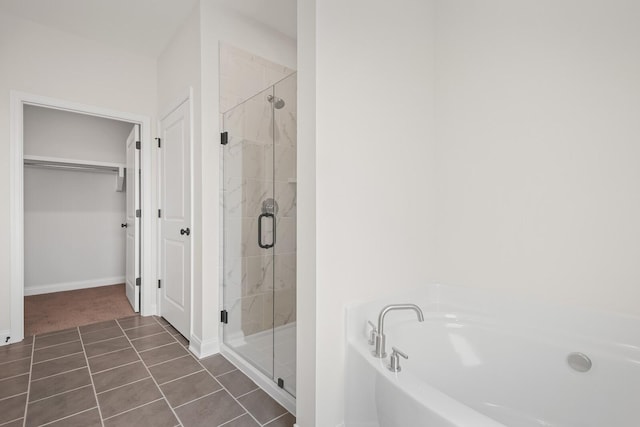 bathroom featuring tile patterned floors and plus walk in shower