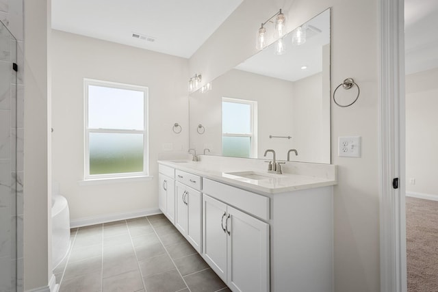 bathroom featuring tile patterned floors and vanity