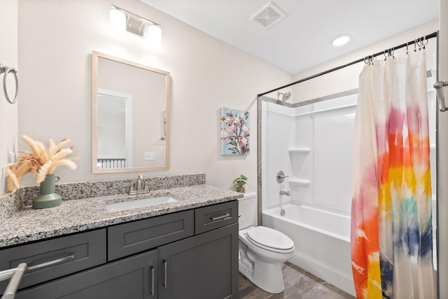 full bathroom with shower / bath combo, vanity, and toilet