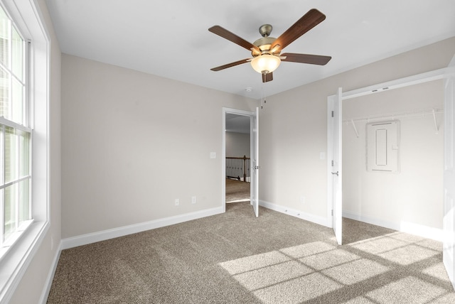 unfurnished bedroom with carpet flooring and ceiling fan