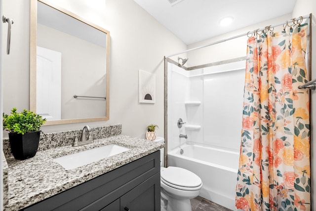 full bathroom featuring vanity, shower / bath combo, and toilet