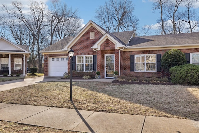 view of front of property with a garage and a front lawn