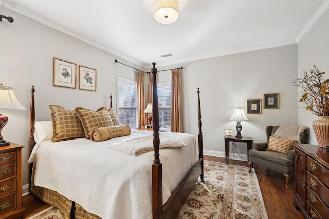 bedroom with crown molding and dark wood-type flooring