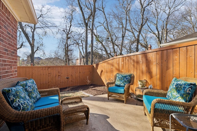 view of patio / terrace with an outdoor living space and a mountain view