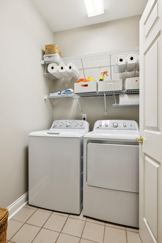 clothes washing area featuring washing machine and clothes dryer