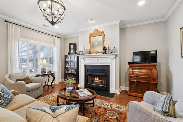 living room with a notable chandelier, ornamental molding, and dark hardwood / wood-style floors