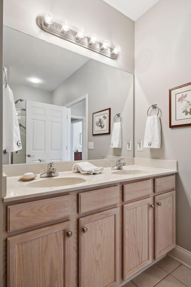 bathroom with tile patterned floors and vanity