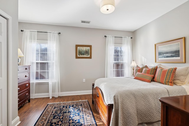 bedroom featuring dark hardwood / wood-style flooring