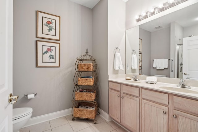 bathroom featuring vanity, curtained shower, tile patterned floors, and toilet