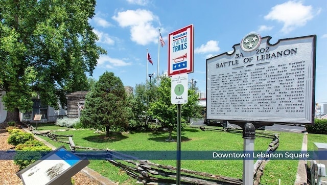 view of property's community featuring a yard