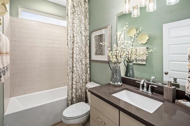 full bathroom featuring vanity, toilet, and shower / bath combo with shower curtain