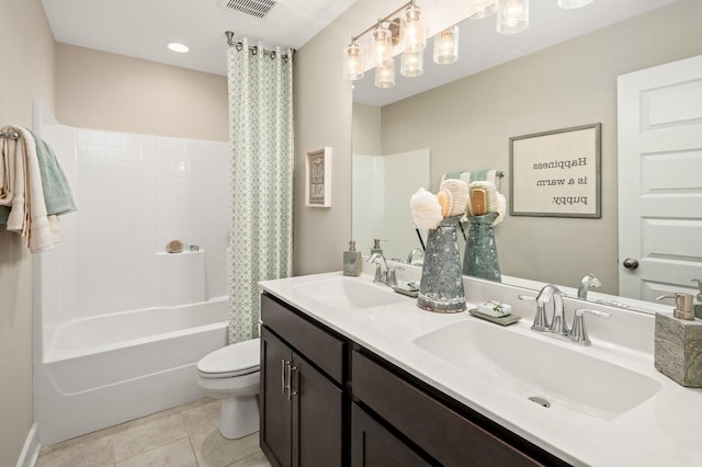 full bathroom featuring vanity, toilet, tile patterned flooring, and shower / bath combo