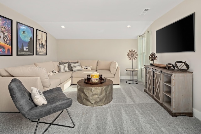 carpeted living room with lofted ceiling