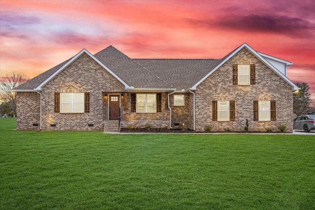 view of front of property with a yard