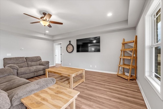 living room with ceiling fan, a healthy amount of sunlight, and hardwood / wood-style floors