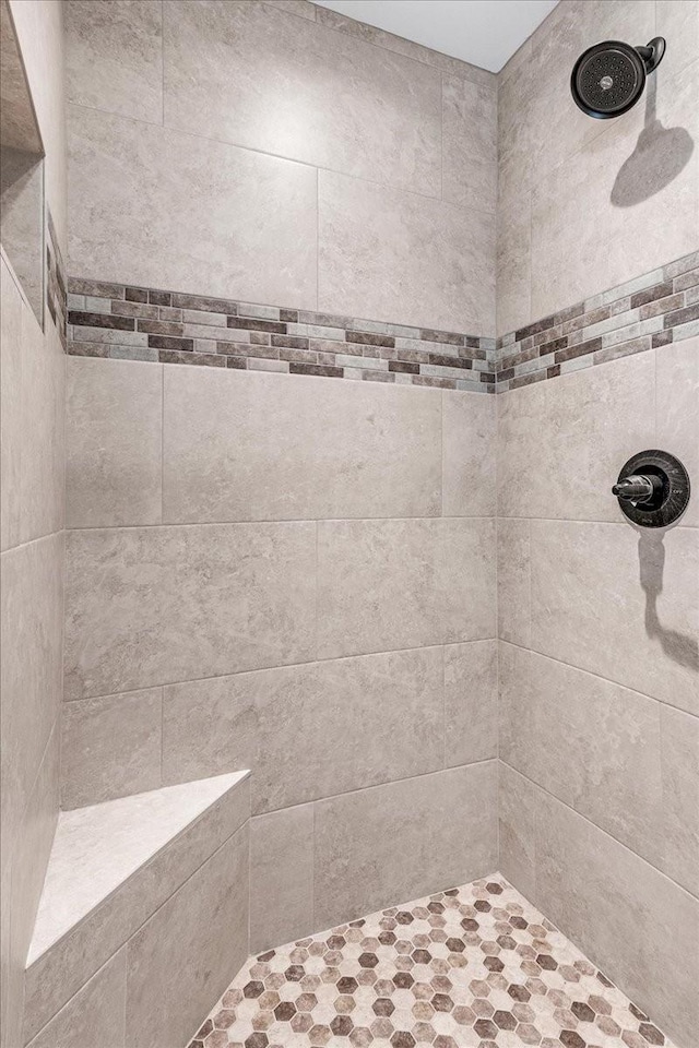 bathroom with a tile shower