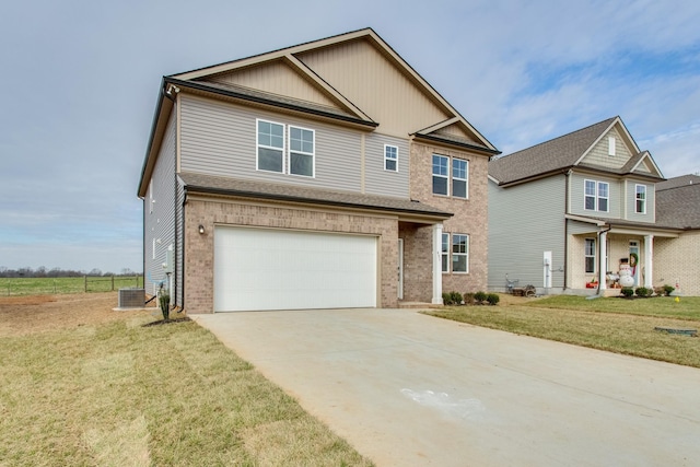 view of front of house featuring a garage and a front lawn