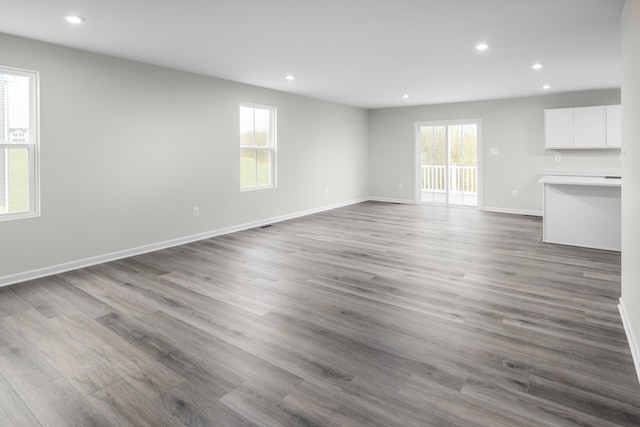 unfurnished living room featuring hardwood / wood-style floors