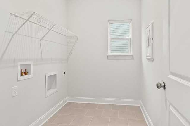 clothes washing area with washer hookup and hookup for an electric dryer