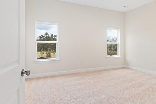 empty room featuring light carpet