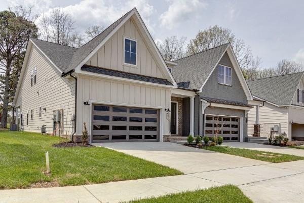 view of front of home with a garage and a front yard