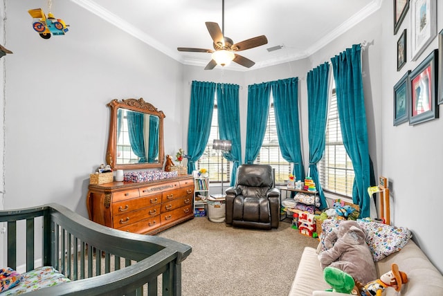 carpeted bedroom featuring crown molding and ceiling fan