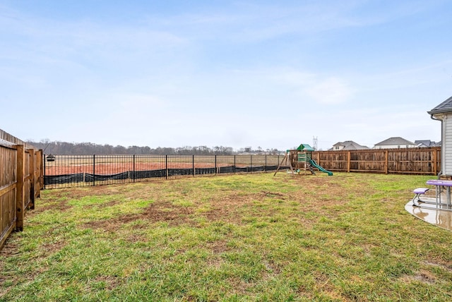 view of yard with a rural view and a playground