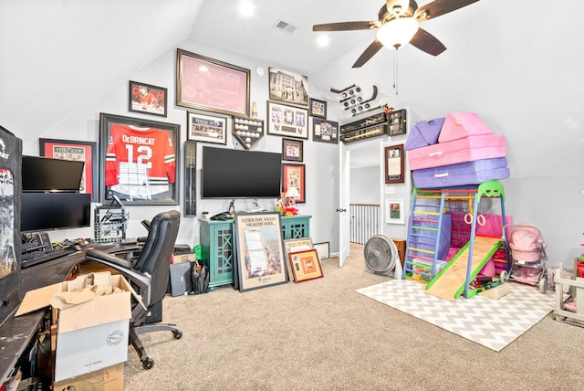 home office featuring vaulted ceiling, carpet floors, and ceiling fan