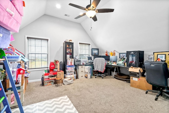 office area featuring vaulted ceiling, carpet flooring, and ceiling fan