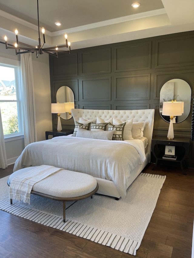 bedroom featuring crown molding and dark hardwood / wood-style floors