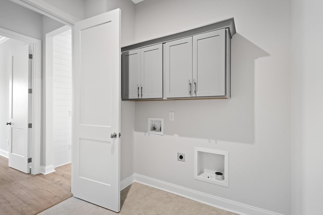 washroom featuring cabinets, washer hookup, and electric dryer hookup