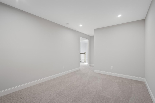 spare room with light carpet