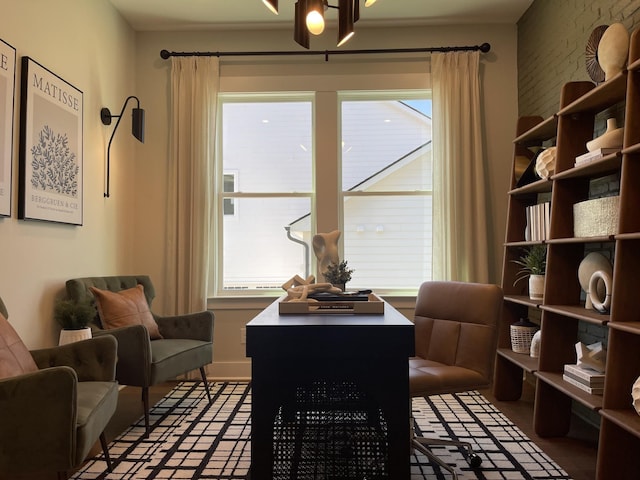 sitting room featuring an inviting chandelier