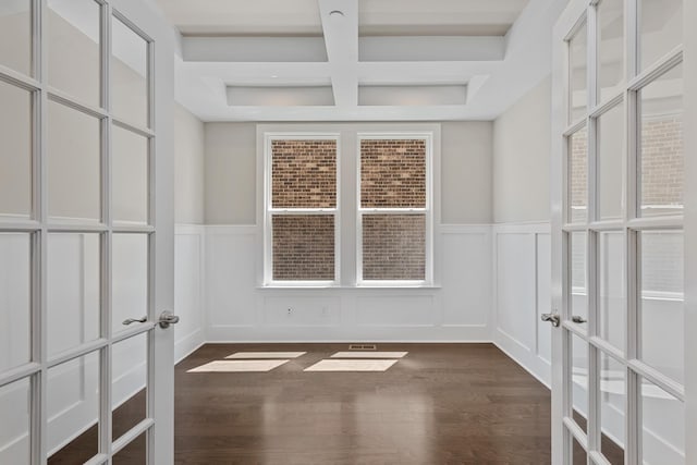 interior space with beamed ceiling and coffered ceiling