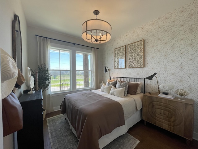 bedroom with a notable chandelier