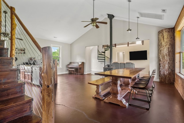 dining space featuring ceiling fan and high vaulted ceiling