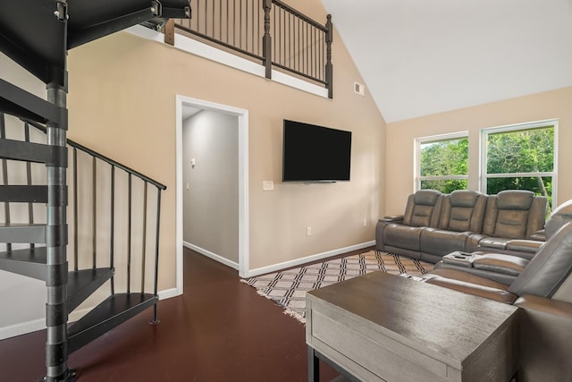 living room with high vaulted ceiling