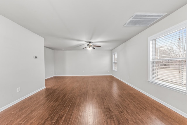 empty room featuring ceiling fan and hardwood / wood-style floors