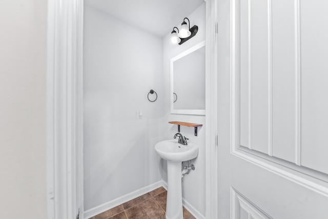 bathroom with tile patterned floors