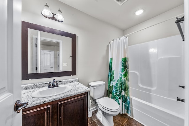 full bathroom with vanity, shower / bathtub combination with curtain, tile patterned floors, and toilet