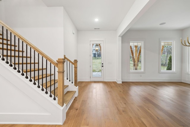 foyer with light hardwood / wood-style floors