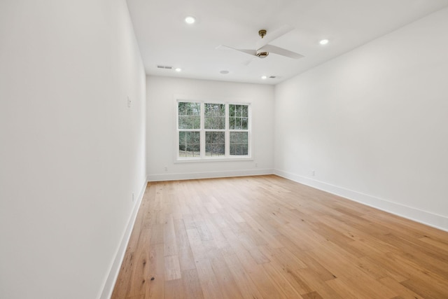 spare room featuring ceiling fan and light wood-type flooring