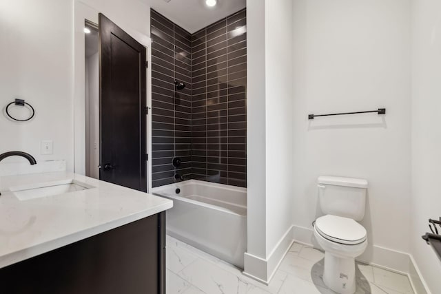 full bathroom featuring vanity, tiled shower / bath combo, and toilet