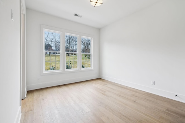 empty room with light wood-type flooring