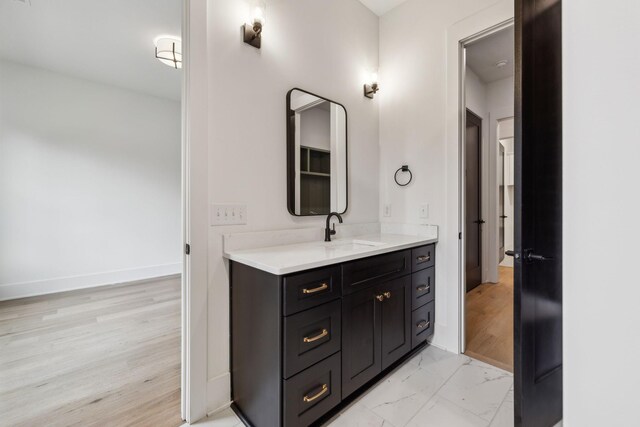 bathroom featuring vanity and hardwood / wood-style floors