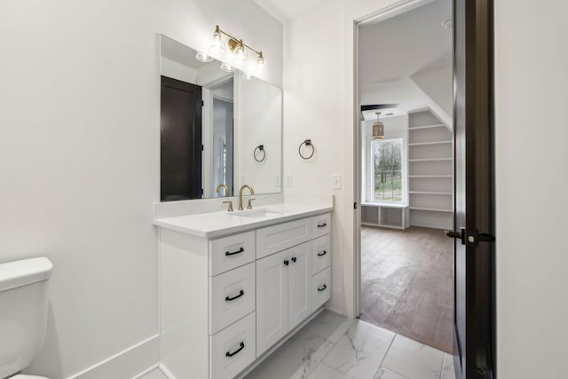 bathroom with vanity and toilet