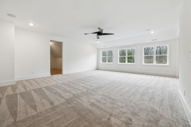 carpeted spare room with ceiling fan