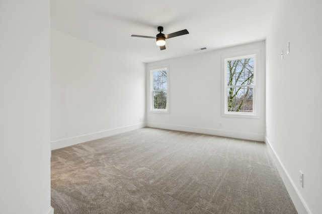 carpeted empty room with ceiling fan