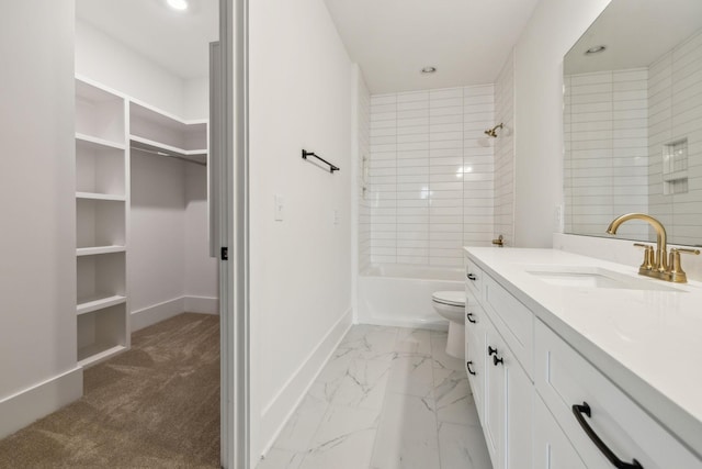 full bathroom featuring vanity, tiled shower / bath, and toilet