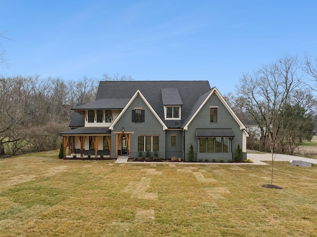 view of front facade featuring a porch and a front lawn